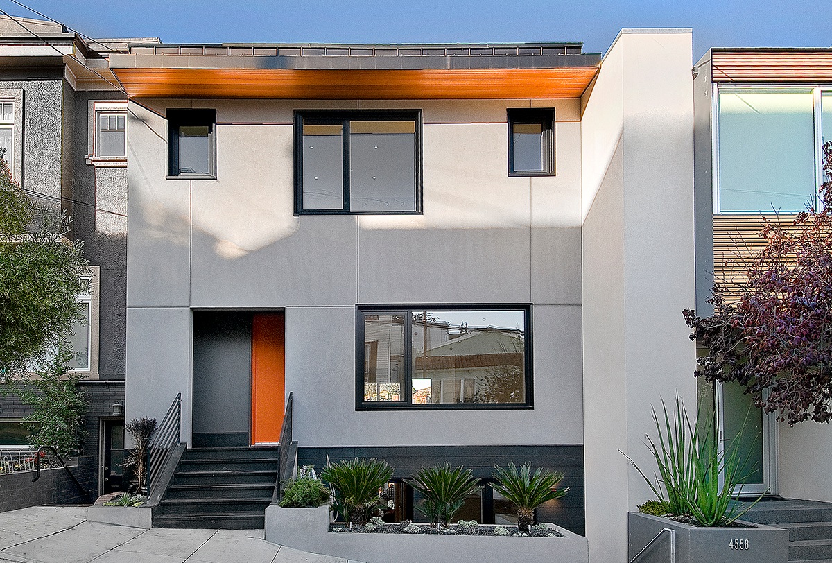 Passive House in Castro California street elevation exterior plaster hood thomas architects orange door